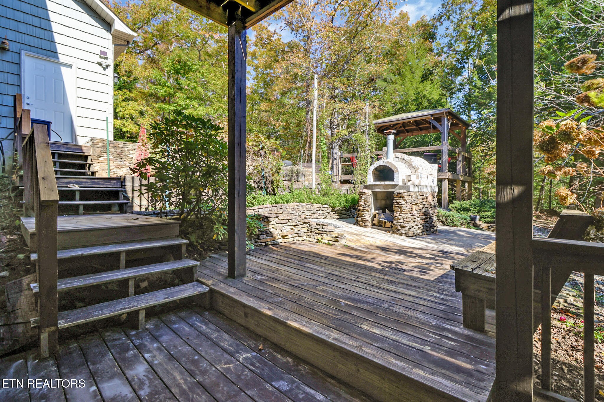 232 Victoria Circle Jamestown, TN 38556 - Photo 40 of 58 a view of a deck with wooden floor and a yard
