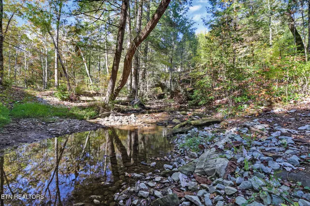 a view of balcony with wooden floor and seating space