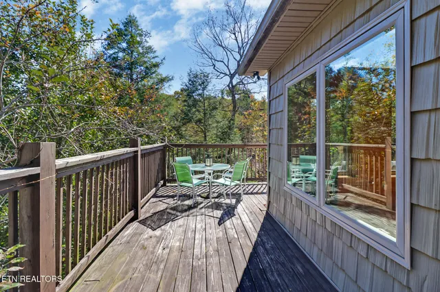 a view of balcony with couch and chairs