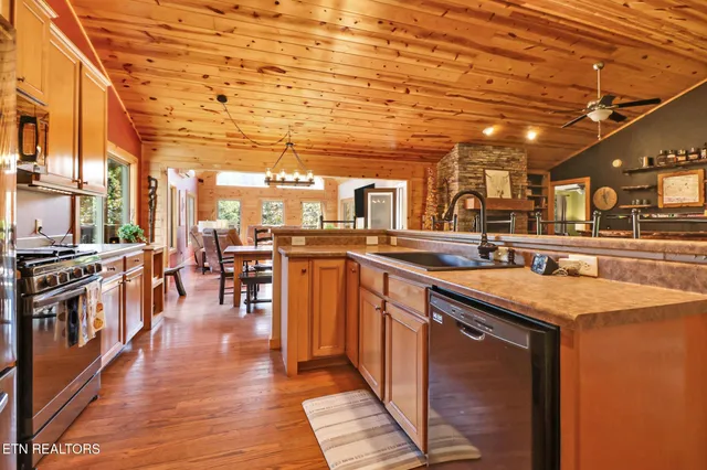 a kitchen with lots of counter top space and stainless steel appliances