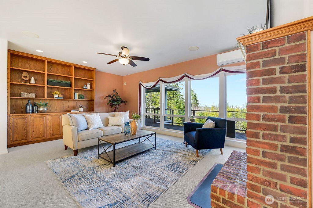 275404 Highway 101 Sequim, WA 98382 - Photo 15 of 40 a living room with furniture a rug and a large window