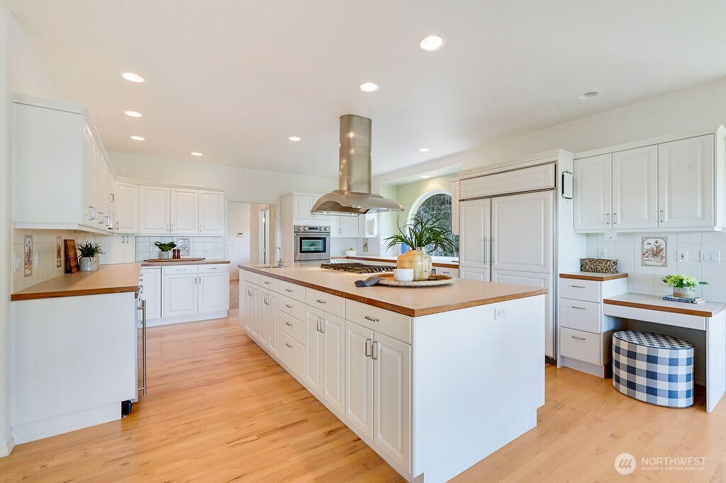 275404 Highway 101 Sequim, WA 98382 - Photo 17 of 40 a kitchen with a sink and white cabinets