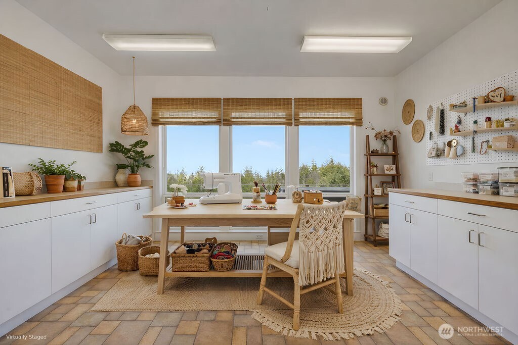 275404 Highway 101 Sequim, WA 98382 - Photo 25 of 40 a large white kitchen with a large window and furniture