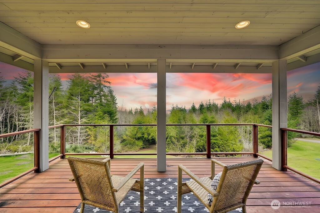 275404 Highway 101 Sequim, WA 98382 - Photo 3 of 40 a view of a porch with furniture and wooden floor