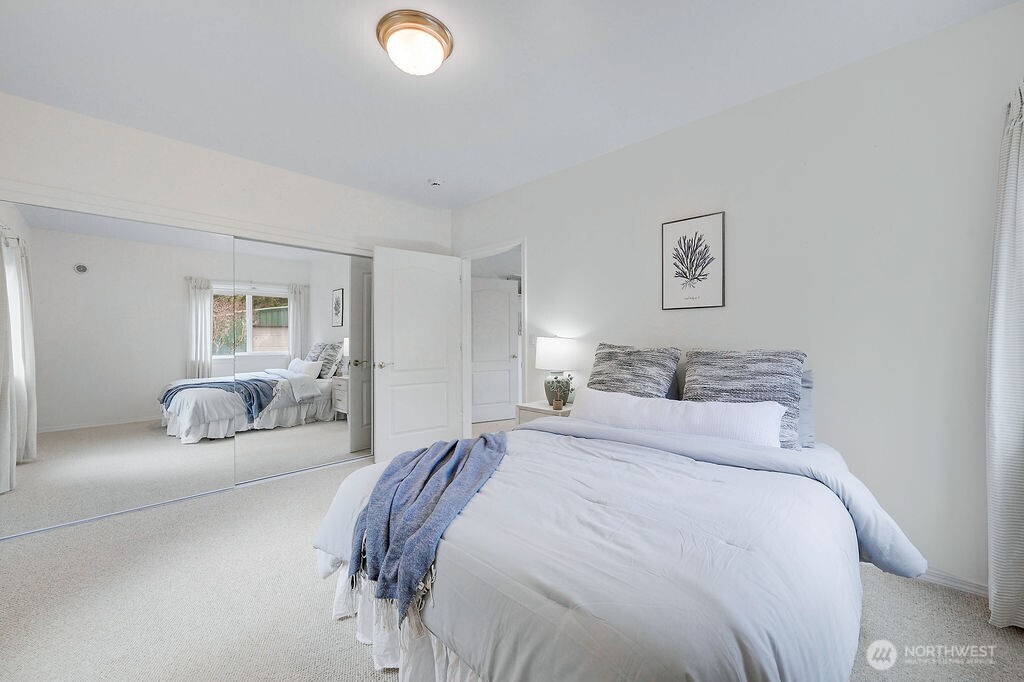 275404 Highway 101 Sequim, WA 98382 - Photo 34 of 40 a bedroom with a bed and a couch