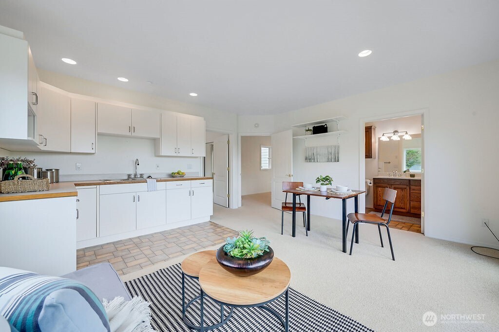 275404 Highway 101 Sequim, WA 98382 - Photo 37 of 40 a living room with furniture and a view of kitchen