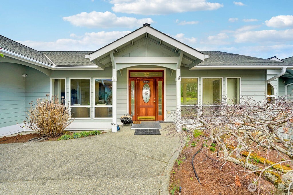 275404 Highway 101 Sequim, WA 98382 - Photo 8 of 40 front view of a brick house with a outdoor space