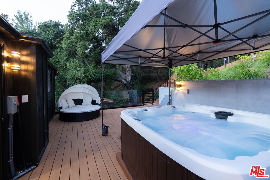 4118 Oak Hollow Road Calabasas, CA 91302 - Photo 32 of 55 a view of outdoor space with a sink and wooden floor