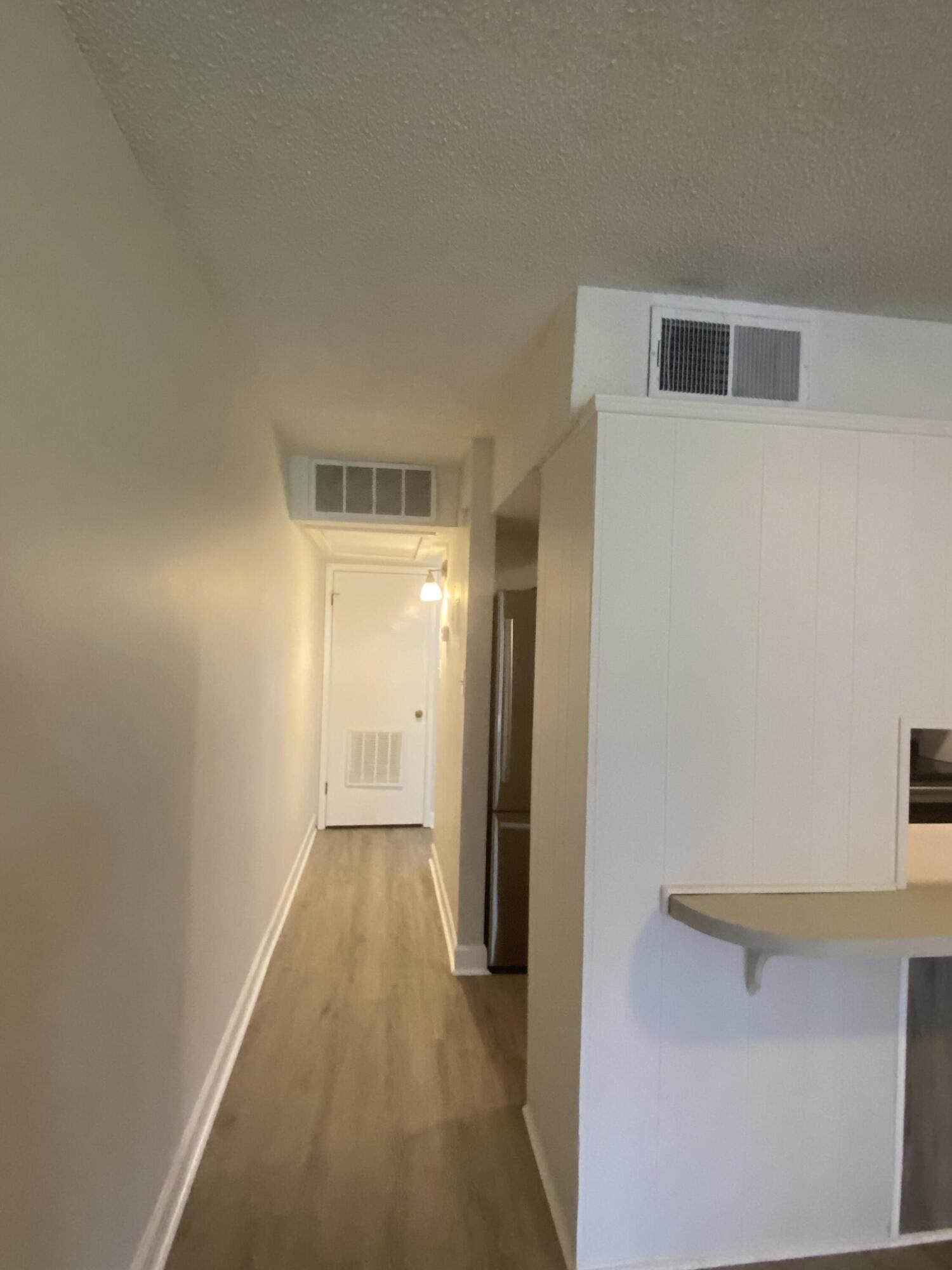 210 Pelham Road, Unit 107C Fort Walton Beach, FL 32547 - Photo 6 of 17 a view of a hallway