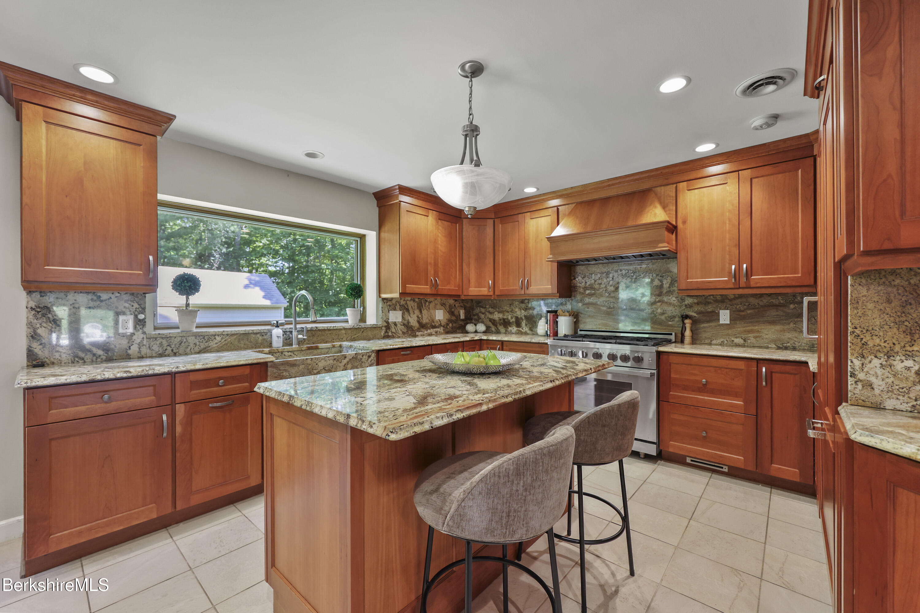 46 West Center Road West Stockbridge, MA 01266 - Photo 4 of 52 a kitchen with stainless steel appliances granite countertop wooden cabinets a stove a sink dishwasher and a microwave oven with cabinets