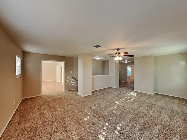 a view of a big room with windows and cabinet