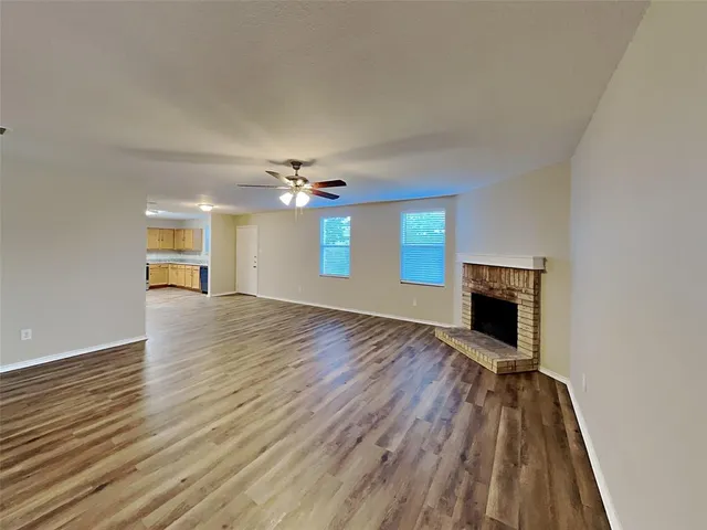 a view of a livingroom with wooden floor