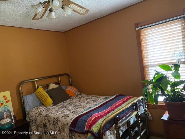 86 James Street Shavertown, PA 18708 - Photo 9 of 23 a bedroom with a bed and a potted plant