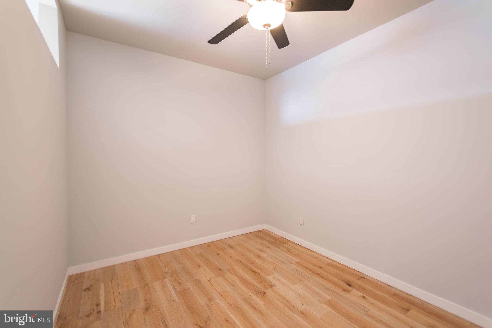 412 South 13th Street, Unit 608 Philadelphia, PA 19147 - Photo 7 of 18 a view of empty room with wooden floor