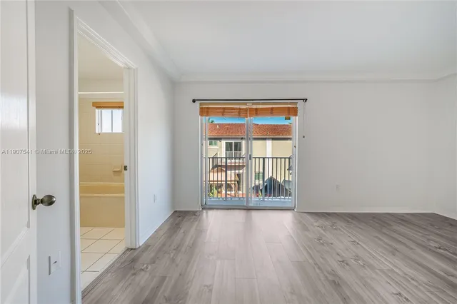 a bathroom with a granite countertop sink a toilet a mirror a bathtub and shower