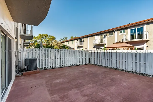 a view of a brick building from a balcony