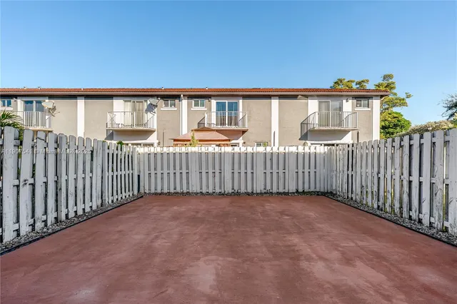 a view of a backyard with wooden floor and outdoor space
