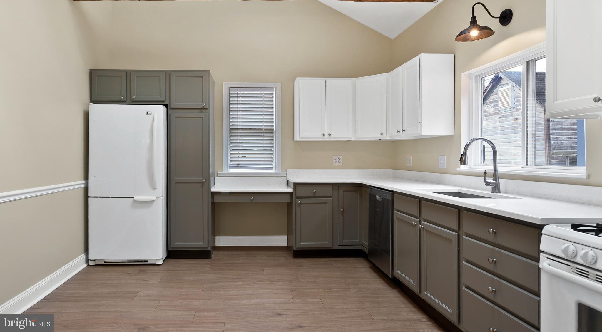 122 Garris Road Downingtown, PA 19335 - Photo 11 of 52 a kitchen with a refrigerator sink and cabinets