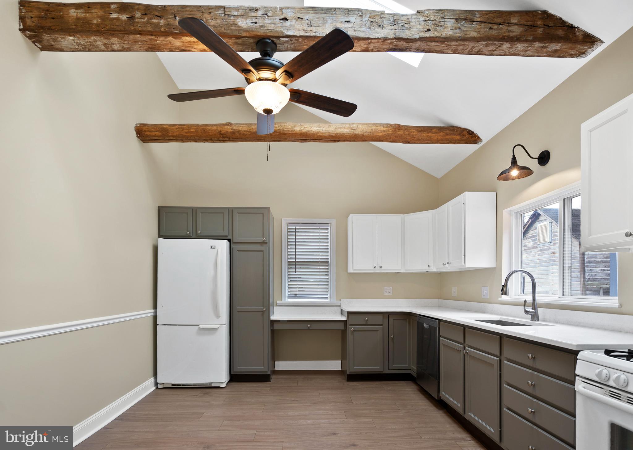 122 Garris Road Downingtown, PA 19335 - Photo 12 of 52 a kitchen with a sink a refrigerator and cabinets