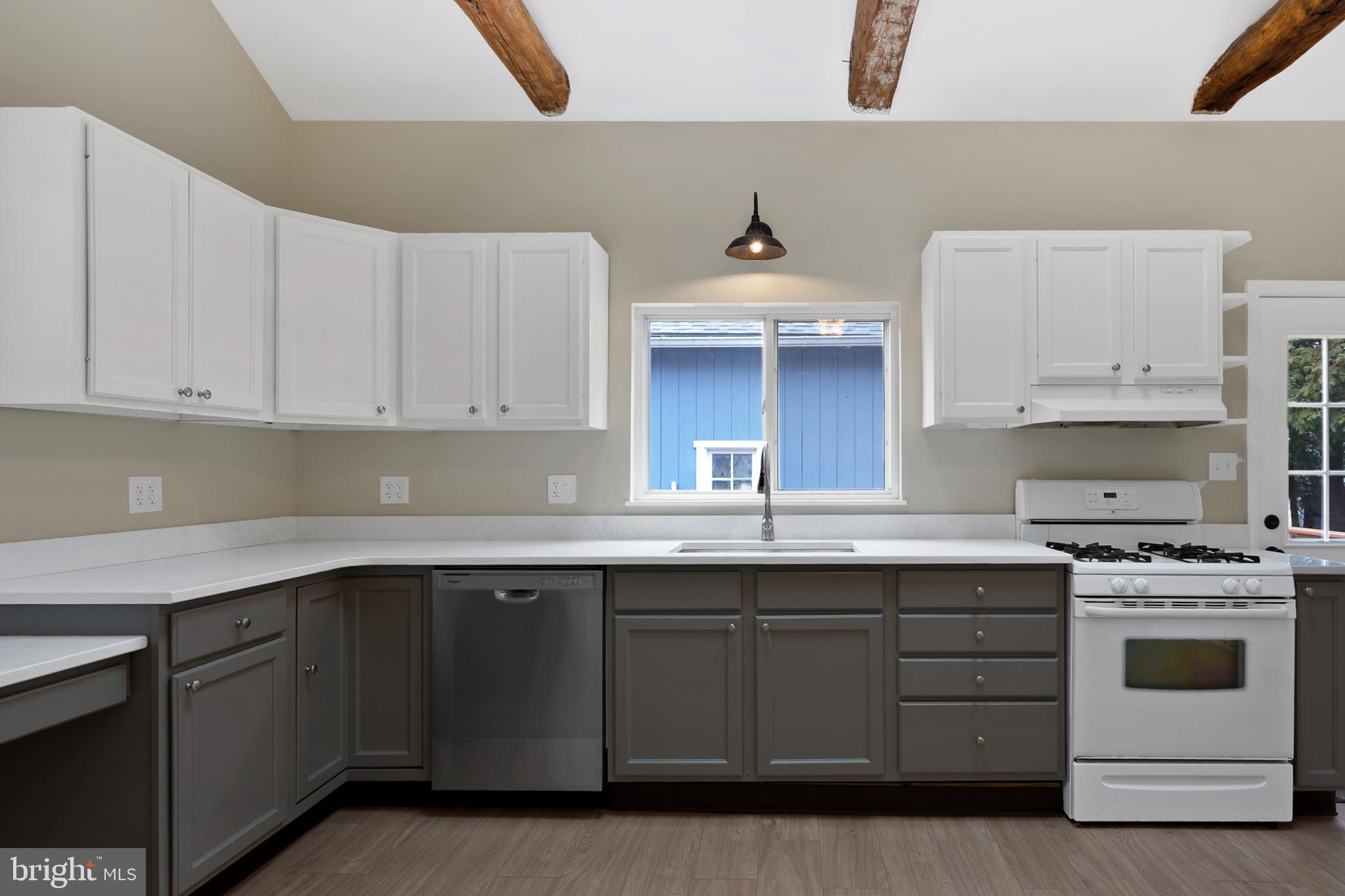 122 Garris Road Downingtown, PA 19335 - Photo 13 of 52 a kitchen with a sink stove and cabinets