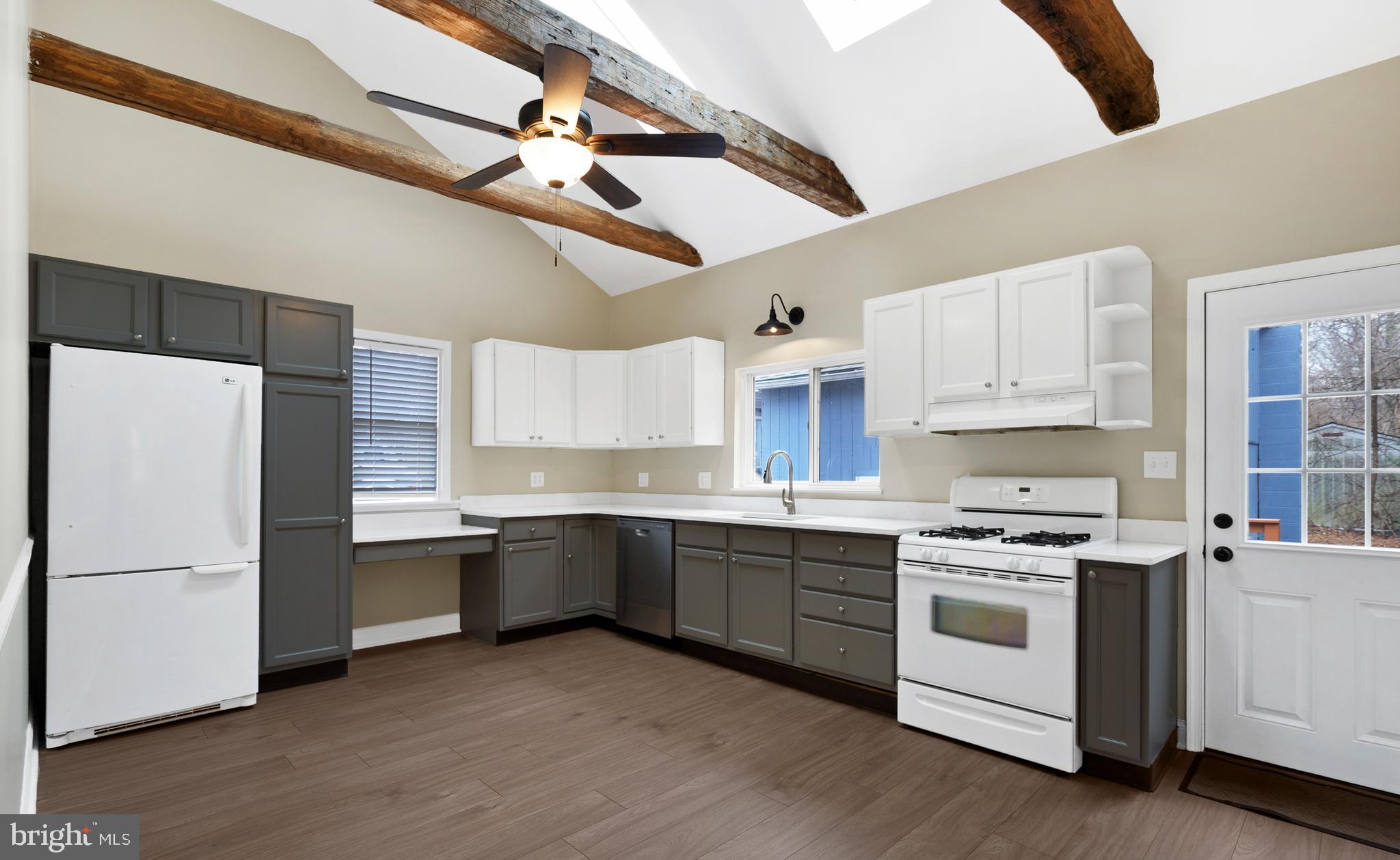 122 Garris Road Downingtown, PA 19335 - Photo 14 of 52 a kitchen with stainless steel appliances a stove a sink and a refrigerator