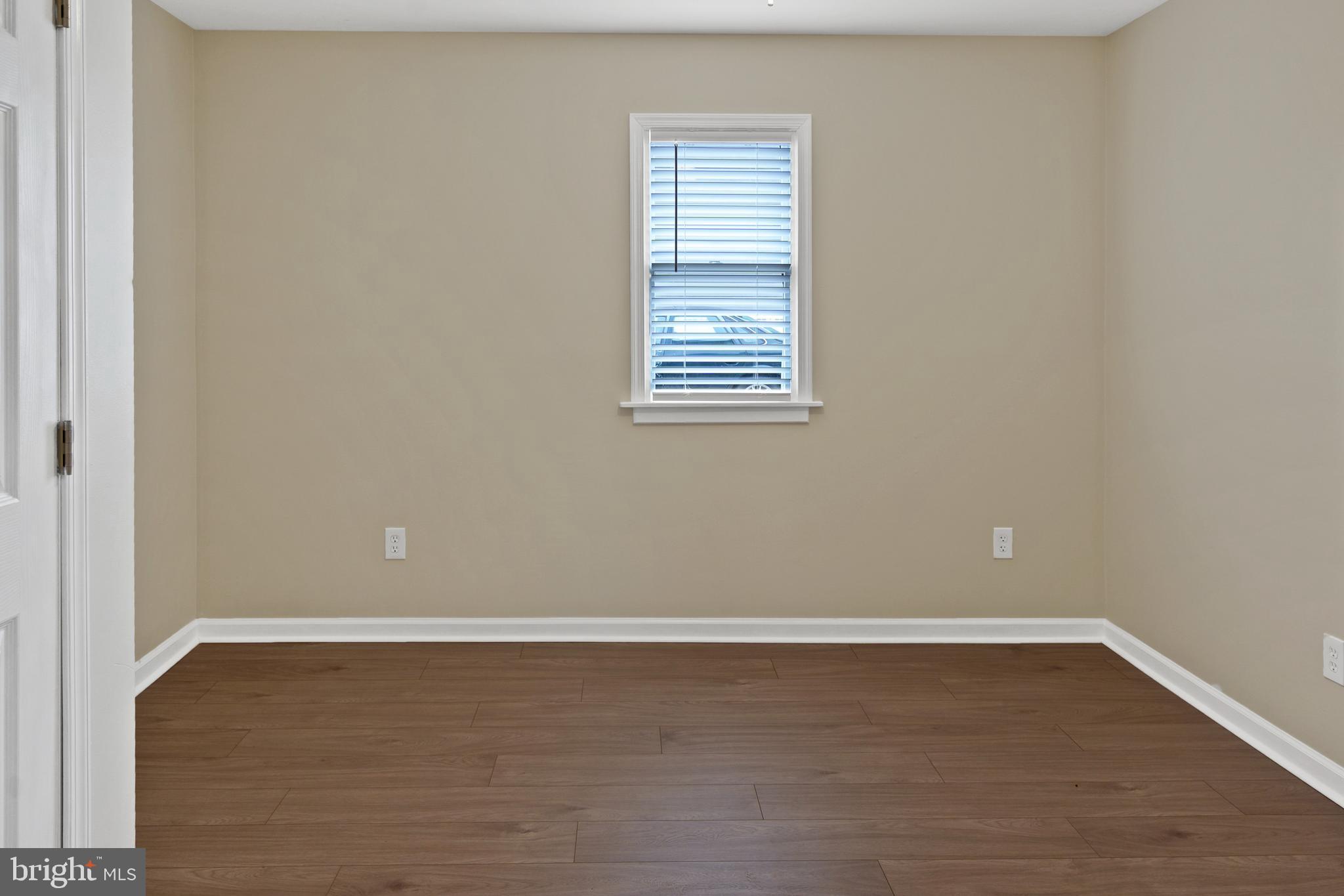 122 Garris Road Downingtown, PA 19335 - Photo 19 of 52 a view of an empty room with wooden floor and a window
