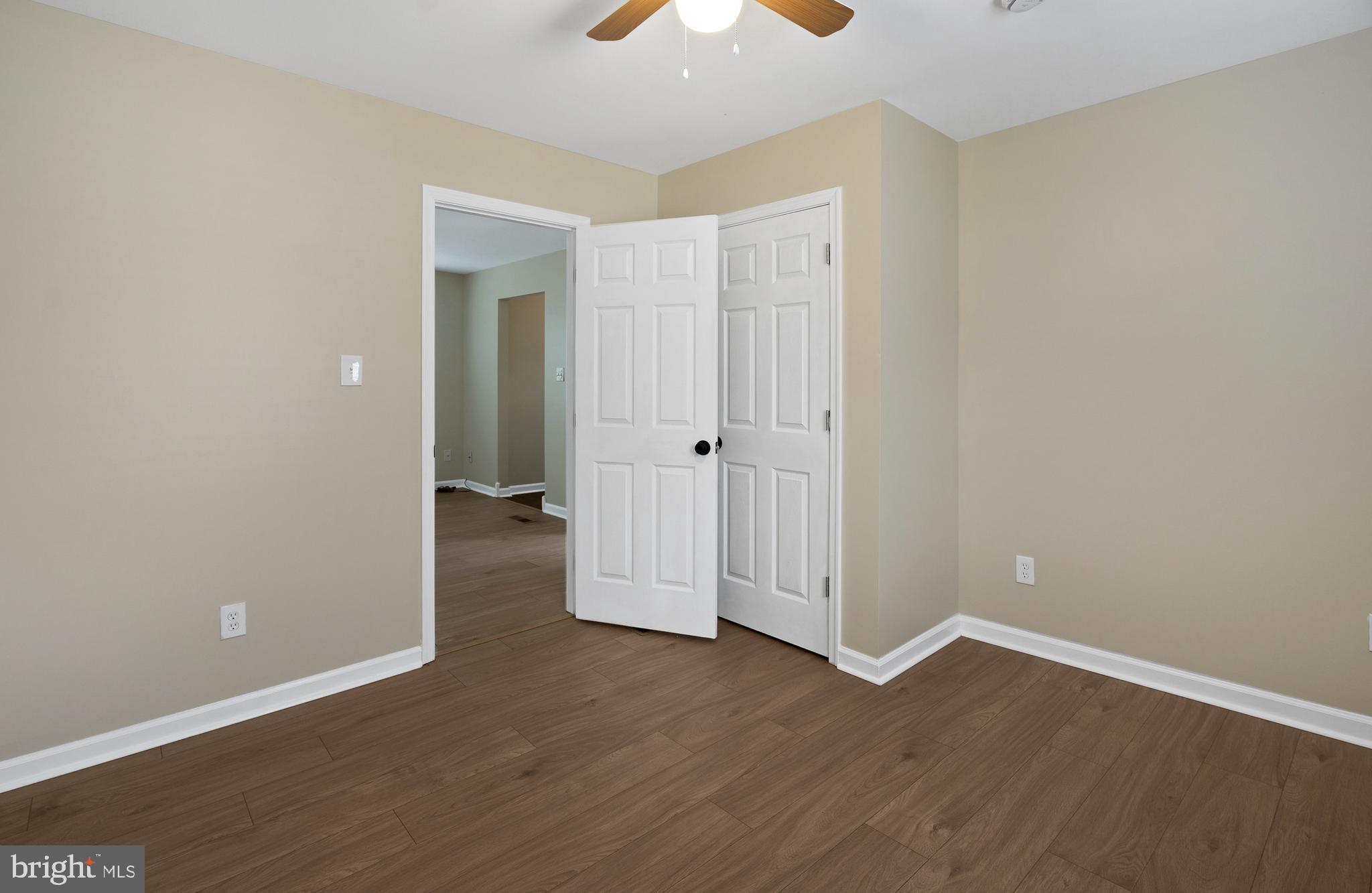 122 Garris Road Downingtown, PA 19335 - Photo 20 of 52 an empty room with wooden floor and a ceiling fan