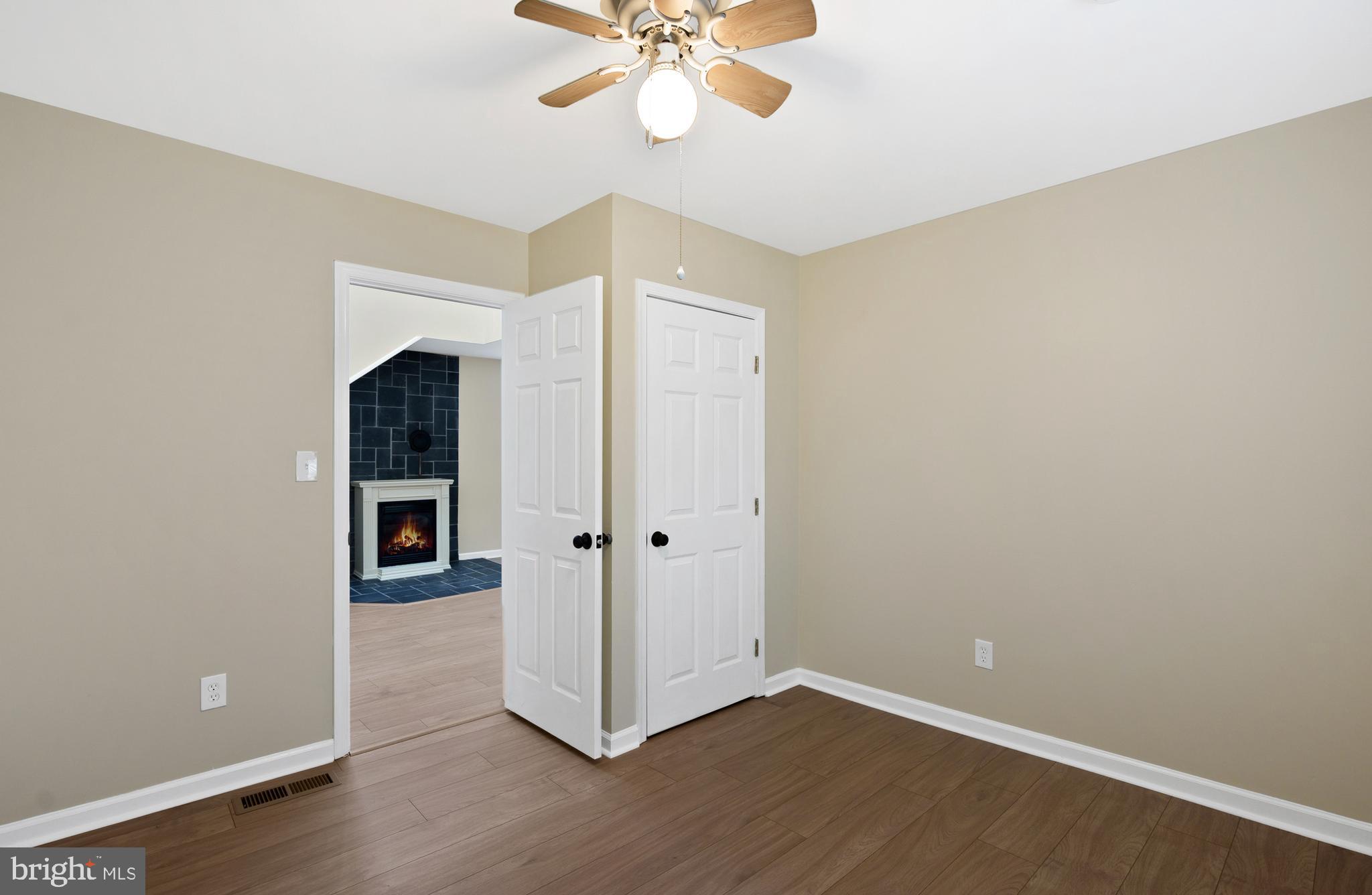122 Garris Road Downingtown, PA 19335 - Photo 22 of 52 an empty room with wooden floor closet and windows