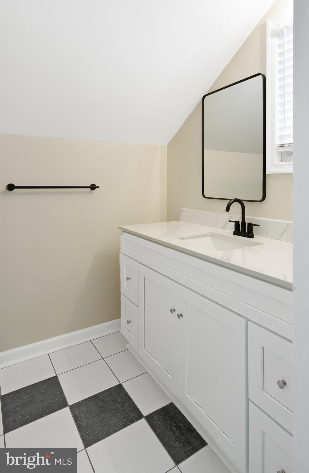 122 Garris Road Downingtown, PA 19335 - Photo 31 of 52 a bathroom with a sink and a mirror