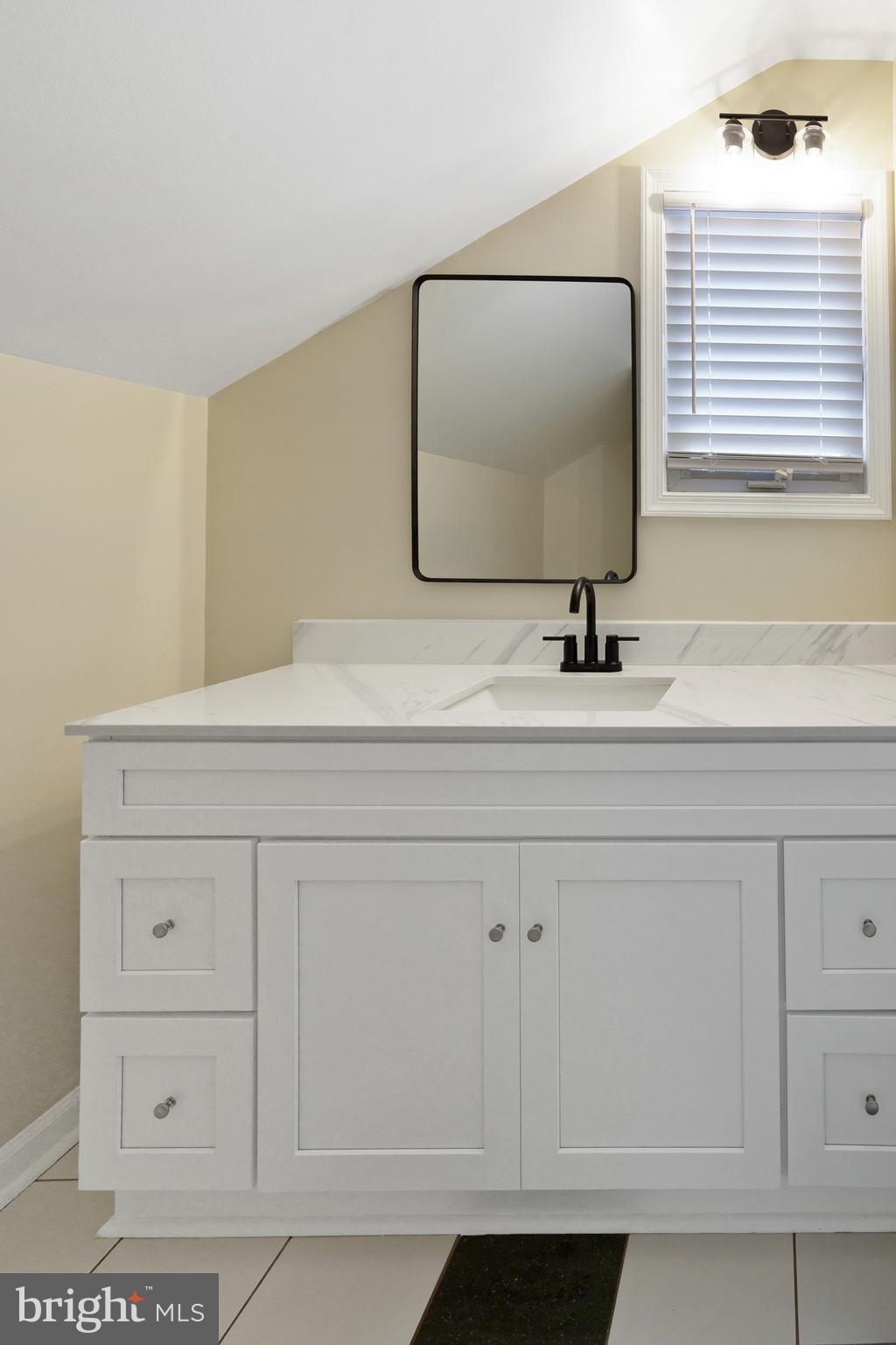 122 Garris Road Downingtown, PA 19335 - Photo 32 of 52 a bathroom with a sink vanity and mirror