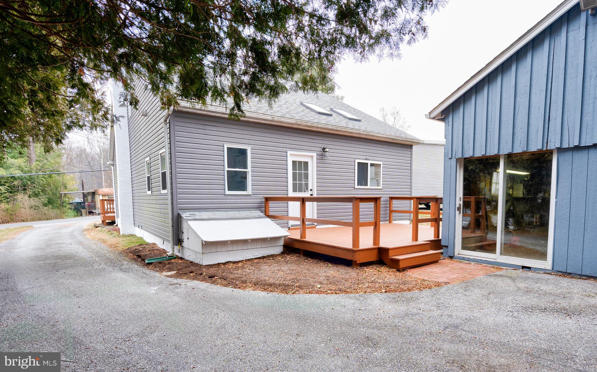 122 Garris Road Downingtown, PA 19335 - Photo 35 of 52 a front view of a house with a yard and garage