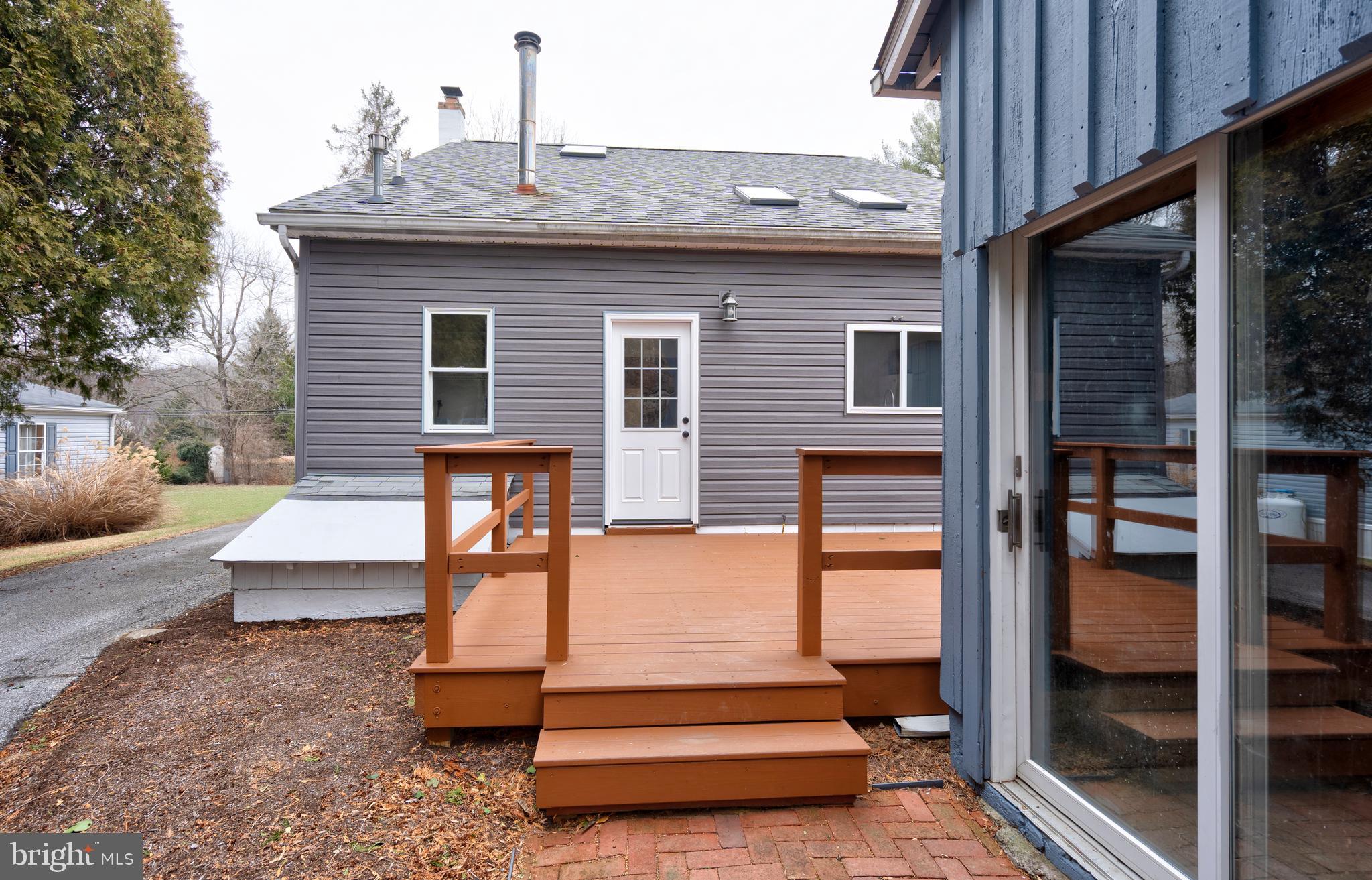122 Garris Road Downingtown, PA 19335 - Photo 37 of 52 a view of backyard with a deck and fireplace
