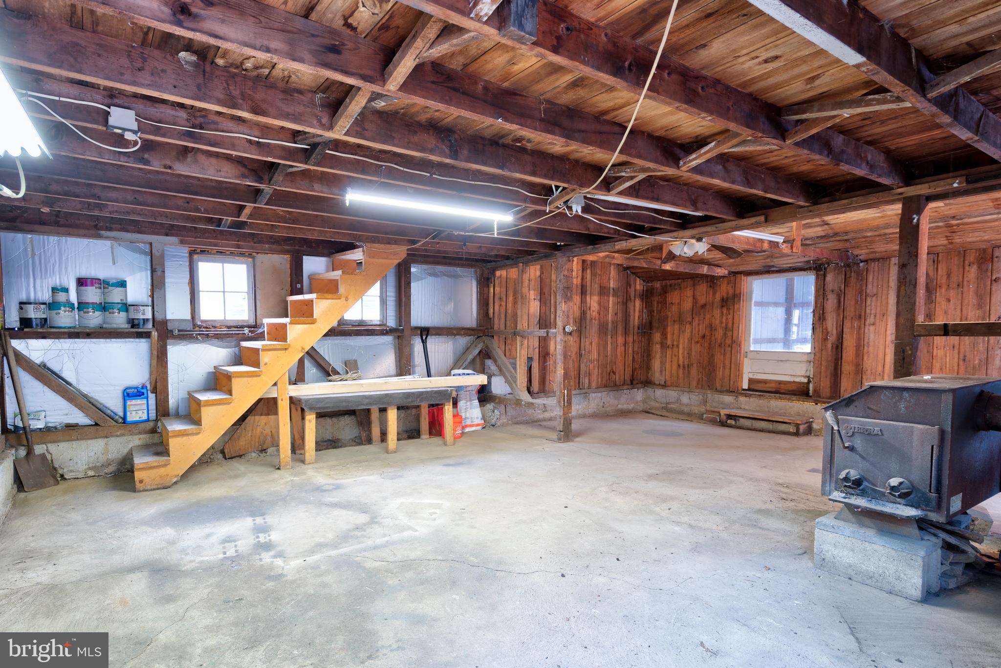 122 Garris Road Downingtown, PA 19335 - Photo 42 of 52 a view of a empty room with windows
