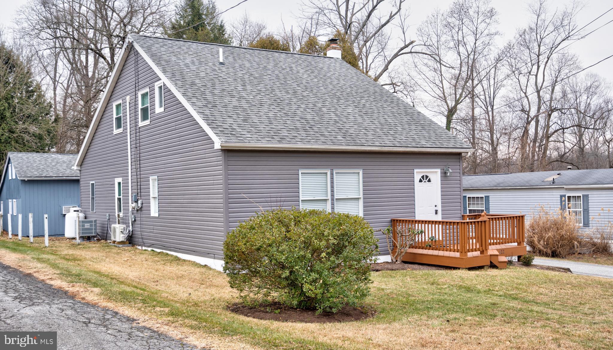 122 Garris Road Downingtown, PA 19335 - Photo 46 of 52 a view of a house with a yard covered in snow