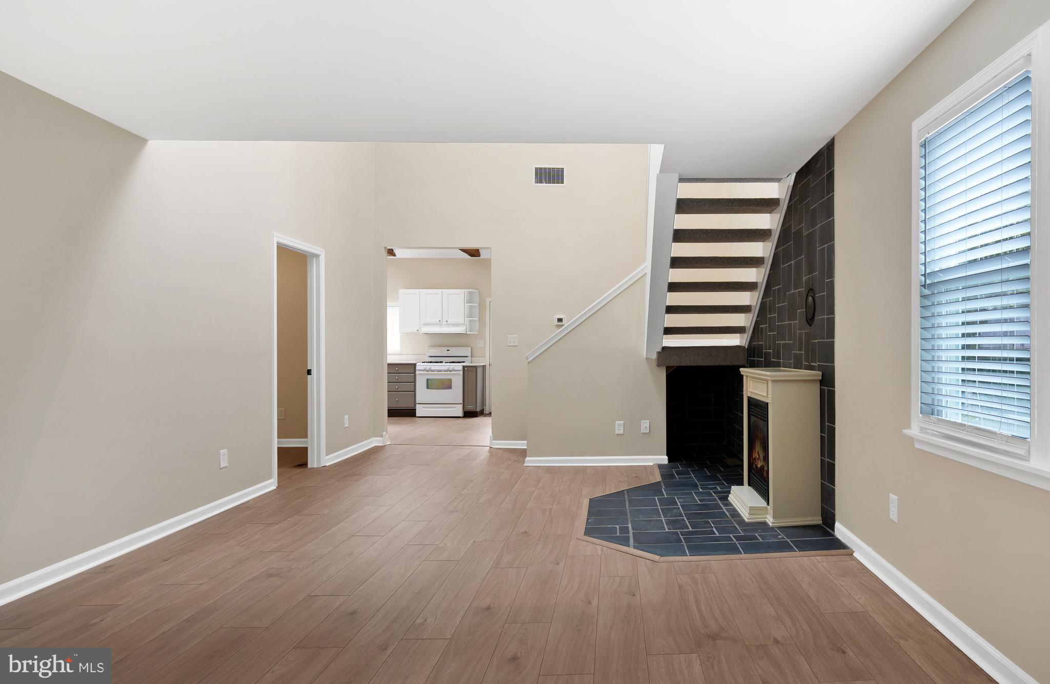 122 Garris Road Downingtown, PA 19335 - Photo 5 of 52 a view of empty room with stairs and wooden floor
