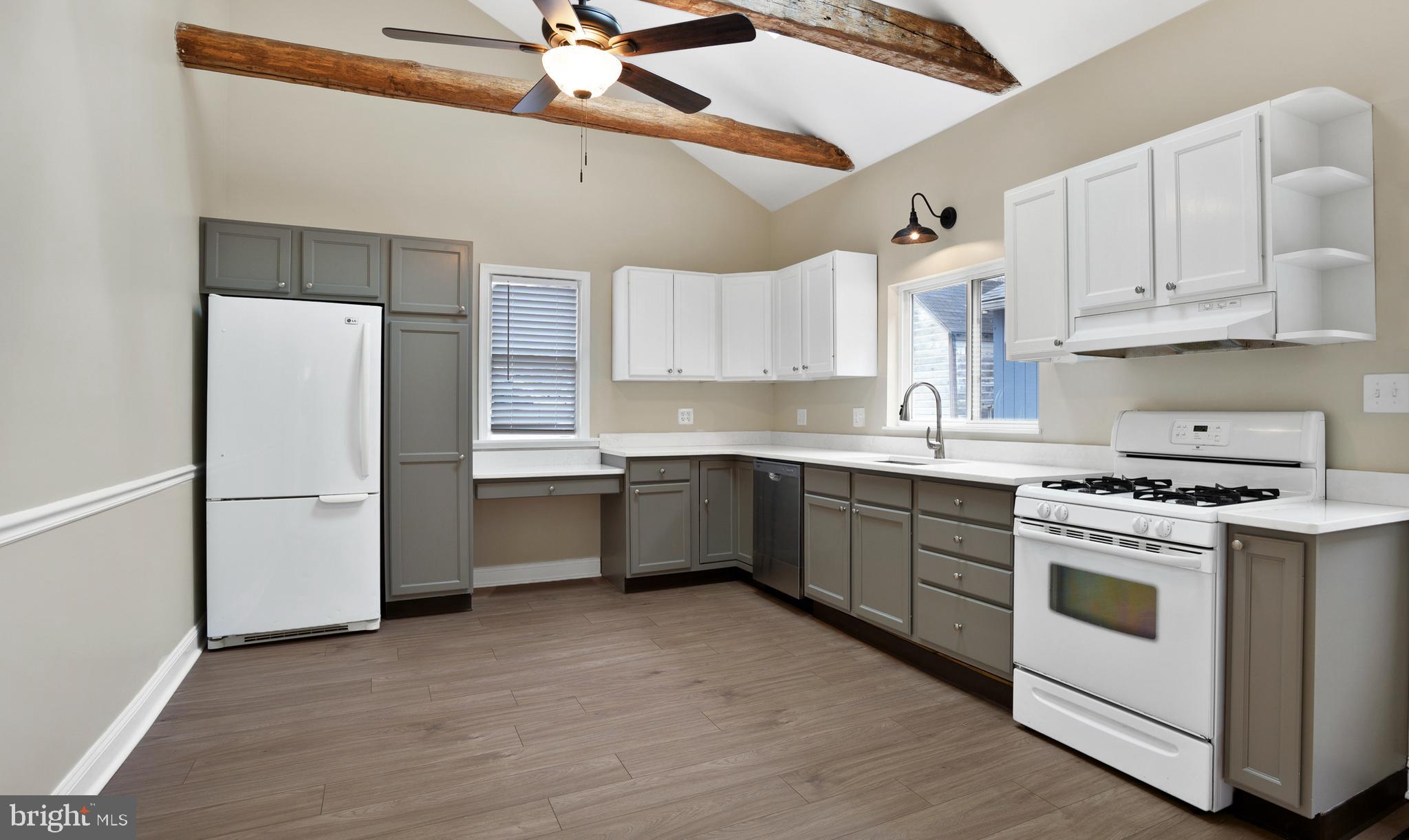 122 Garris Road Downingtown, PA 19335 - Photo 9 of 52 a kitchen with a white cabinets and white appliances