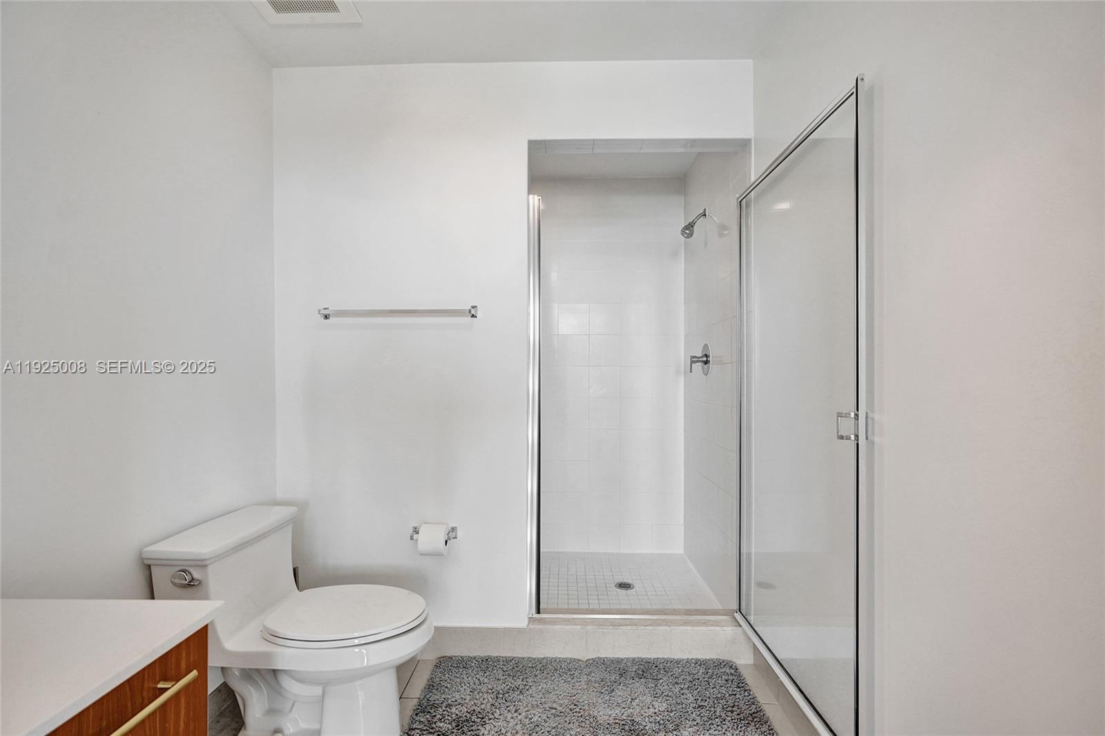3301 Northeast 1st Avenue, Unit H2205 Miami, FL 33137 - Photo 14 of 28 a bathroom with a shower and a toilet