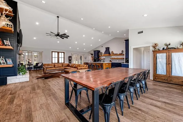 an open kitchen with a table and chairs in it