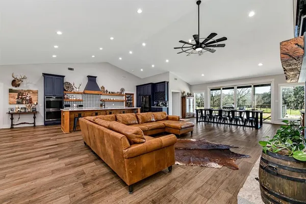 a living room with furniture and a large window