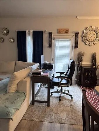 a workspace with furniture and rug