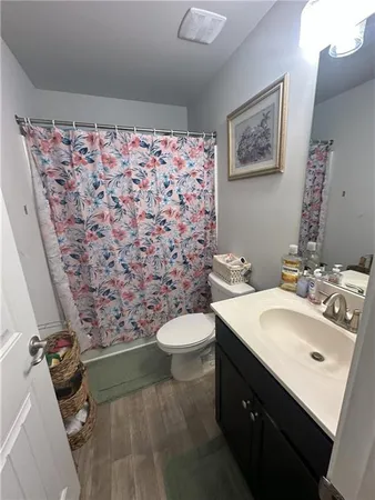 a bedroom with two beds and a dresser