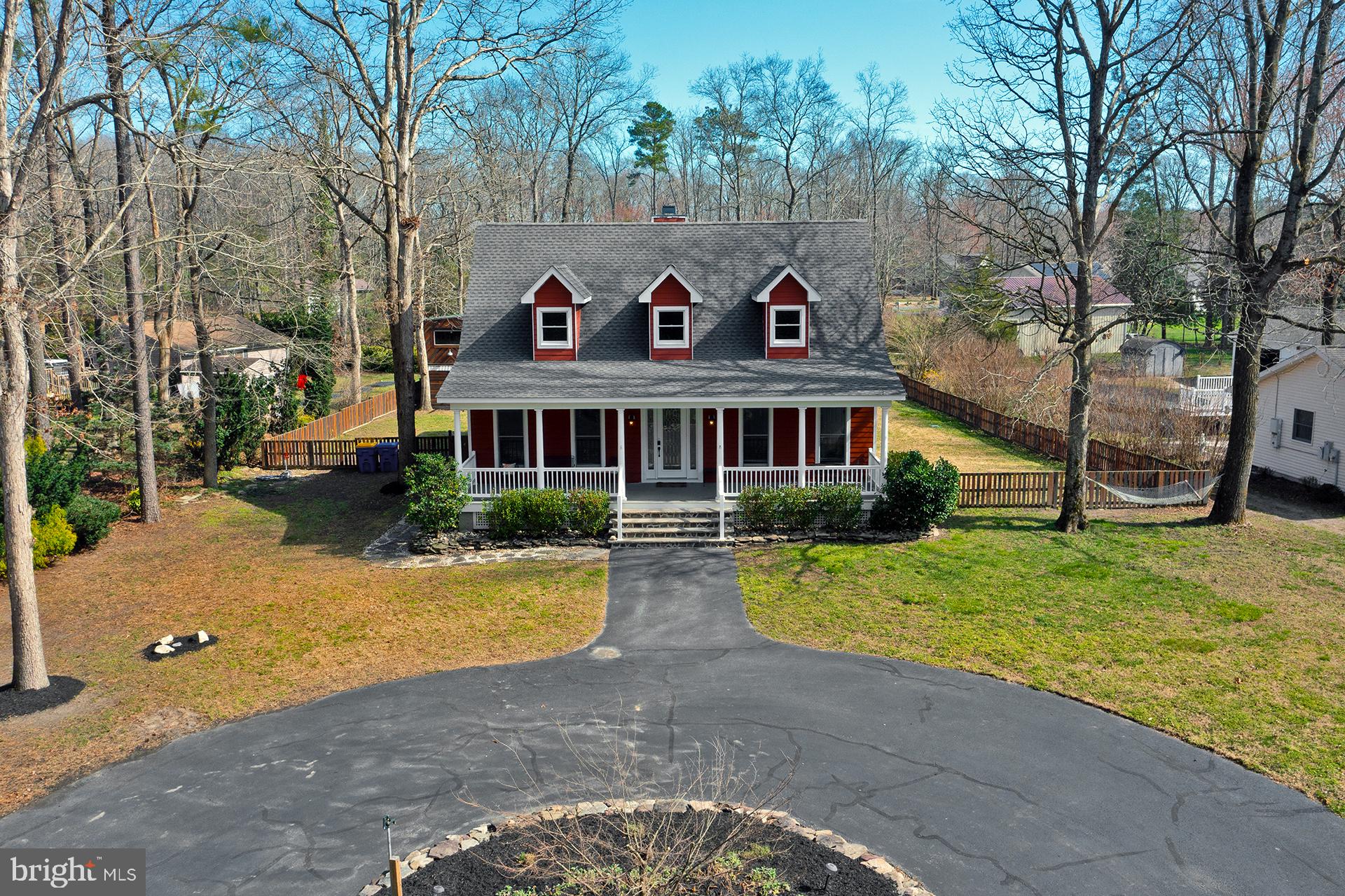 Charming home nestled among trees.