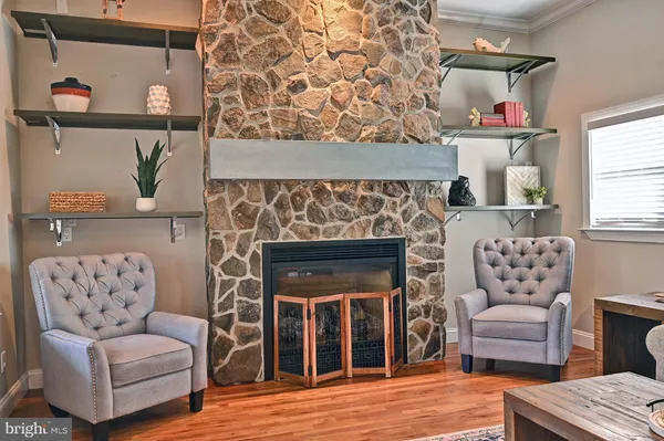 a kitchen with a sink a large window and cabinets