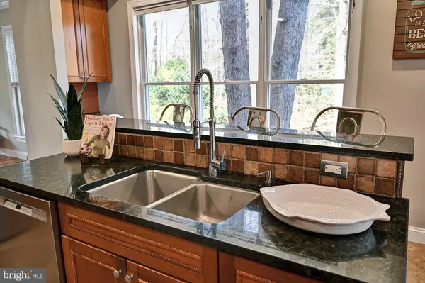a stove top oven sitting inside of a kitchen