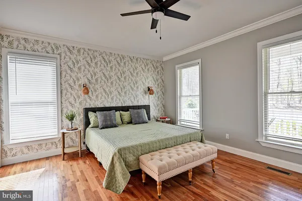 a bathroom with a sink a mirror and a shower