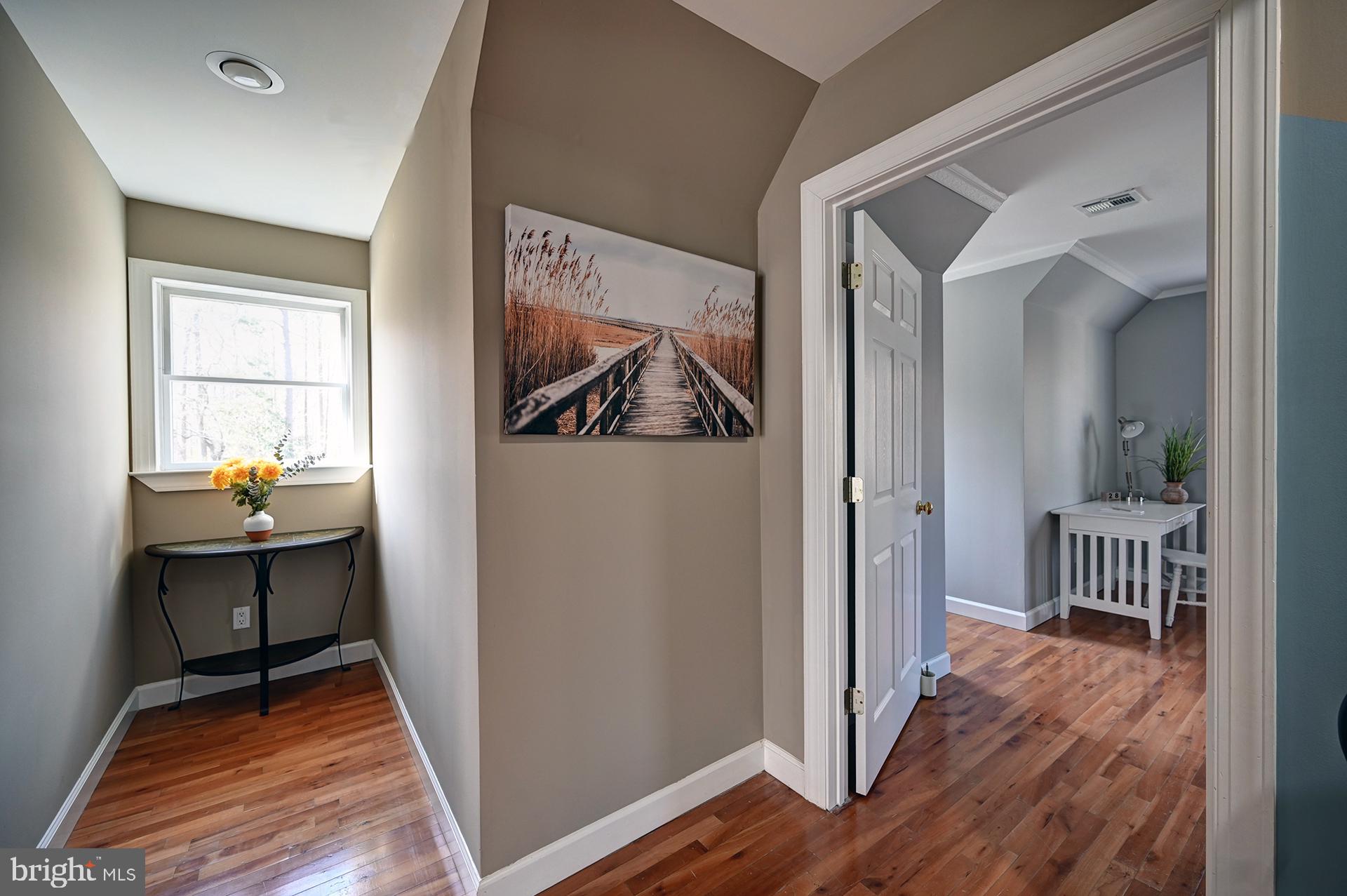 31765 Hickory Manor Road Frankford, DE 19945 - Photo 37 of 53 a view of hallway with wooden floor and furniture