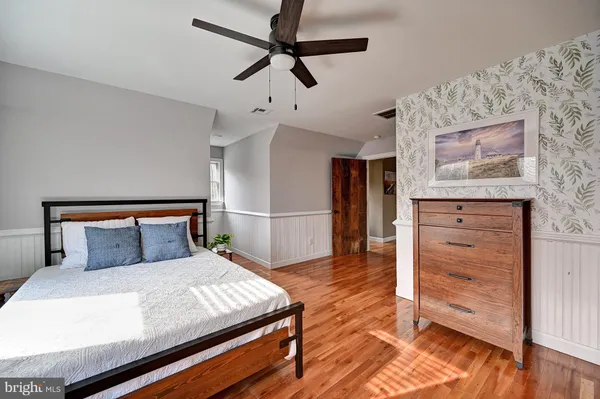 a view of an entryway with wooden floor