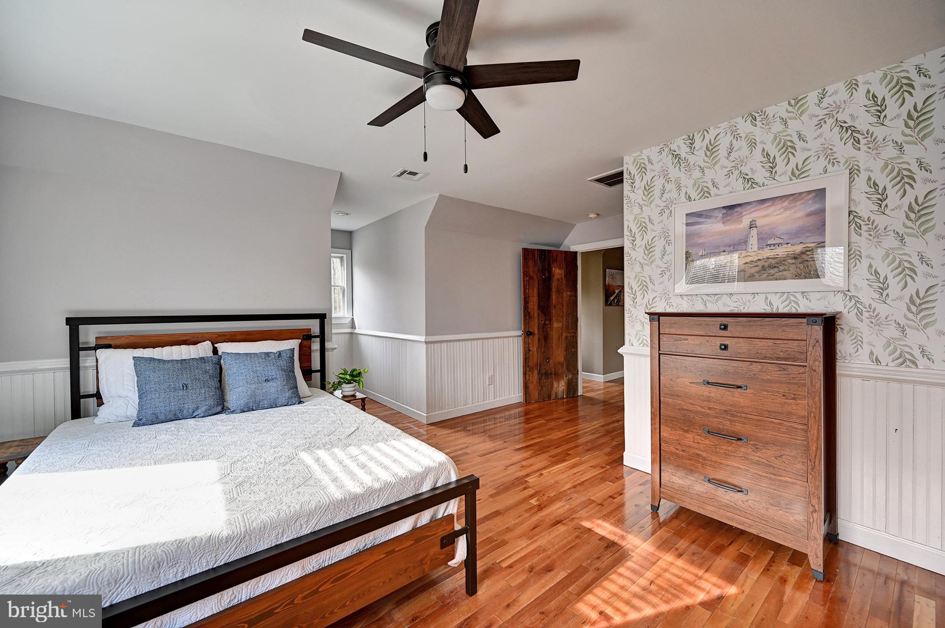 31765 Hickory Manor Road Frankford, DE 19945 - Photo 40 of 53 a bedroom with a bed and wooden floor