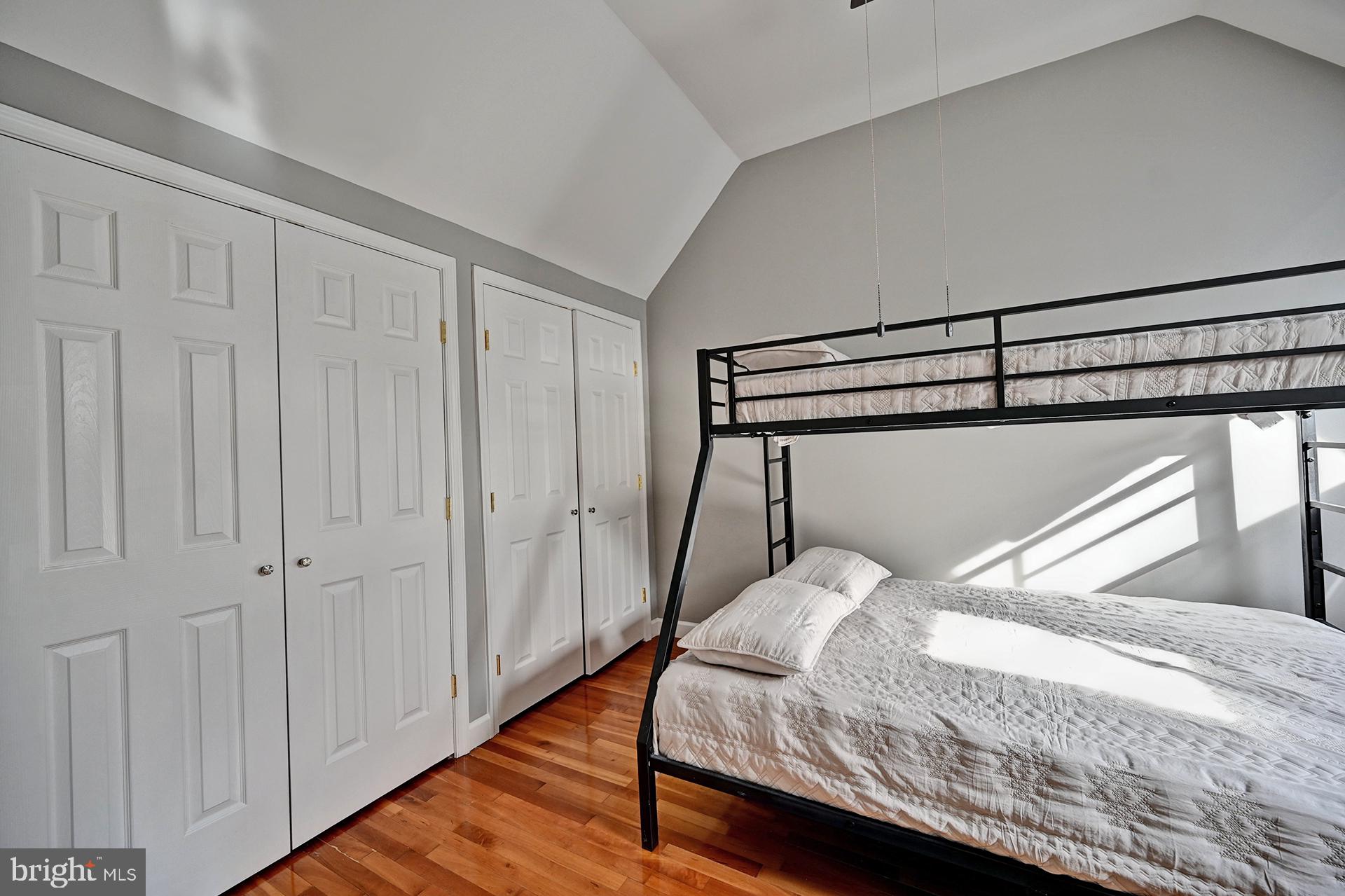 31765 Hickory Manor Road Frankford, DE 19945 - Photo 48 of 53 a bedroom with a bed and wooden floor