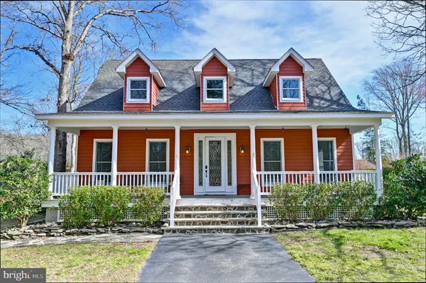 a view of a balcony with a table and chairs